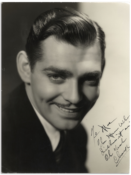 Clark Gable MGM Photo Inscribed to Moe Howard, ''To Moe / The man who dishes it out / Oh yeah / Clark'' -- Circa 1933 -- 9.25'' x 12'' Half-Glossy Photo Is Trimmed, Else Very Good Plus